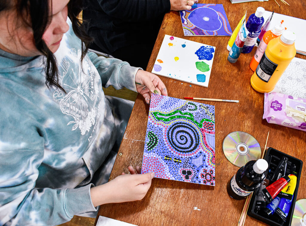 Teenager focusing on arts and crafts